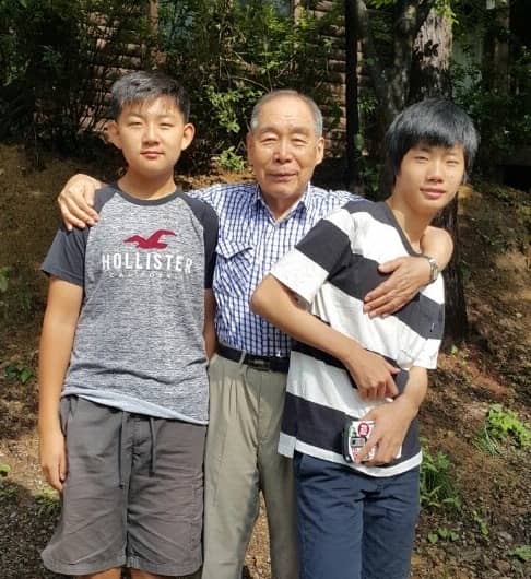 Grandpa with two of his grandchildren