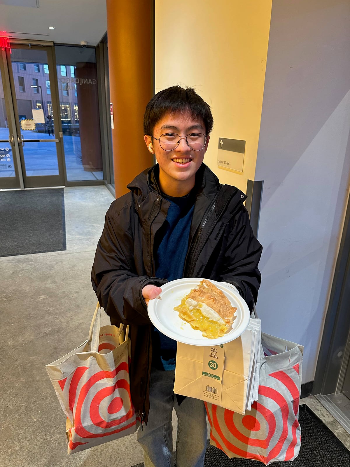 Ben holding a slice of pie